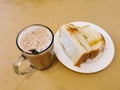 Malaysian breakfast which is milk tea or the tarik, half boiled eggs and kaya butter toast set on the table. Royalty Free Stock Photo