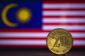 Malaysian coin - Malaysia 20 Sen 1973 coin isolated on malaysia flag background. Malaysian currency twenty sen coin with space for Royalty Free Stock Photo