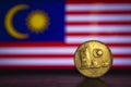 Malaysian coin - Malaysia 20 Sen 1973 coin isolated on malaysia flag background. Malaysian currency twenty sen coin with space for Royalty Free Stock Photo