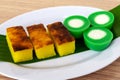 Malaysian dessert kuih Nona Manis and kuih bingka ubi or Baked Tapioca Cassava Cake Royalty Free Stock Photo
