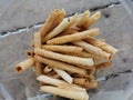 Malaysian famous traditional snack known as Kuih Kapit inside the plastic jar. Popular during Eid celebration.