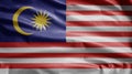 Malaysian flag waving in the wind. Close up of Malaysia banner blowing soft silk Royalty Free Stock Photo