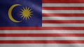 Malaysian flag waving in the wind. Close up of Malaysia banner blowing soft silk Royalty Free Stock Photo