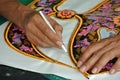 Malaysian kite maker working on a kite in his workshop Royalty Free Stock Photo