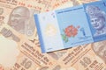 A Malaysian ringgit on a background of Indian ten rupee bank notes Royalty Free Stock Photo