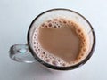 Malaysian signature drink called `TEH TARIK`. Tea drinks mixed with creamy white creamers.