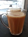 Malaysian signature drink called `TEH TARIK`. Tea drinks mixed with creamy white creamers.