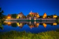 Malbork castle over the Nogat river at night, Poland Royalty Free Stock Photo