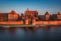 Malbork castle over the Nogat river at sunset, Poland