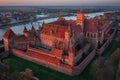 Malbork castle over the Nogat river at sunset, Poland