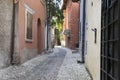Malcesine / Italy - June 11, 2017: Romantic narrow streets of historic village Malcesine during the touristic season