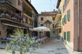 Malcesine / Italy - June 11, 2017: Romantic narrow streets of historic village Malcesine during the touristic season