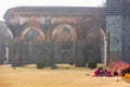 Beautiful stone arches in the misty ruins of the ancient Adina Masjid mosque in the