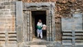 Malda, West Bengal, India - January 2018: A woman framed by stone door in the ruins of the ancient Adina Masjid mosque in the