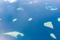 Maldives aerial panorama blue water reef and coral islands Royalty Free Stock Photo