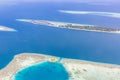 Maldives aerial panorama blue water reef and coral islands Royalty Free Stock Photo