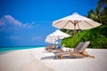 Maldives beach shezlongs 2 Royalty Free Stock Photo