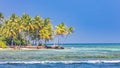 Beautiful beach with palm trees and moody sky. Summer vacation travel holiday background concept. Maldives paradise beach Royalty Free Stock Photo