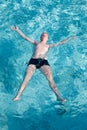 Maldives. The boy has a rest on transparent water