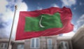 Maldives Flag 3D Rendering on Blue Sky Building Background