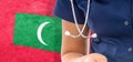 Maldives flag female doctor with stethoscope