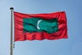 Maldives flag waving against clear blue sky