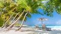 Beautiful beach. Chairs on the sandy beach near the sea. Summer holiday and vacation concept. Inspirational tropical background Royalty Free Stock Photo