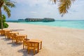 Maldives Resort Beach with Chairs and Tables Royalty Free Stock Photo