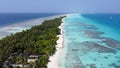 Maldives resort island drone aerial view, Indian ocean atoll nature beach and palm forest, leisure tourist luxury vacation Royalty Free Stock Photo