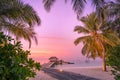 Maldives resort island in sunset with wooden pier, amazing colorful sky. Perfect sunset beach Royalty Free Stock Photo