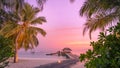 Maldives resort island in sunset with wooden pier, amazing colorful sky. Perfect sunset beach Royalty Free Stock Photo