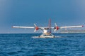 Seaplane at tropical beach resort. Luxury summer travel destination with seaplane in Maldives islands. Exotic vacation or holiday