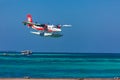 12.15.2015: Seaplane at tropical beach resort. Luxury summer travel destination with seaplane in Maldives islands