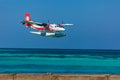 12.15.2015: Seaplane at tropical beach resort. Luxury summer travel destination with seaplane in Maldives islands