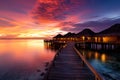 Maldives sunset at luxury water villas, a dreamy beach paradise Royalty Free Stock Photo