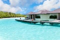 Maldives. Villa on piles on water against island