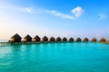 Maldives. Villa on piles on water at the time suns