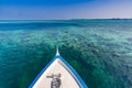 Maldivian dhoni boat in blue ocean background. Maldives traditional wooden boat called Dhoni. Tropical sea and wooden boat