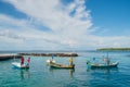 Maldivian fishermen fishing in the boats at the harbor at the tropical island in the ocean