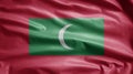 Maldivian flag waving in the wind. Close up of Maldives banner blowing soft silk