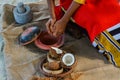 Maldivian girl cooking breakfast from coconuts Royalty Free Stock Photo