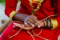 Maldivian girl making hand made rope