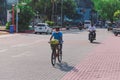 Maldivian Local People riding on the Bikes on the Male City streets