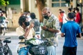 Maldivian men chating in the masks at the street during covid -19 corona virus pandemic