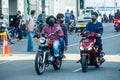 Maldivian men in masks riding motobikes on the street during covid-19