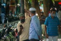 Maldivian men in the masks talking at the street during corona virus pandemic