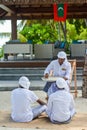 Maldivian muslim teacher giving lesson to his male students