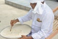 Maldivian muslim teacher writing on the sand