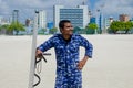 Maldivian police officer with shield and baton