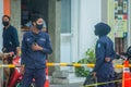 Maldivian police officers wearing masks on the street during covid-19